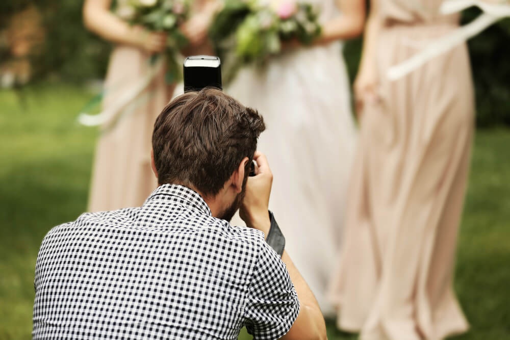 closeup of wedding photographer taking pictures