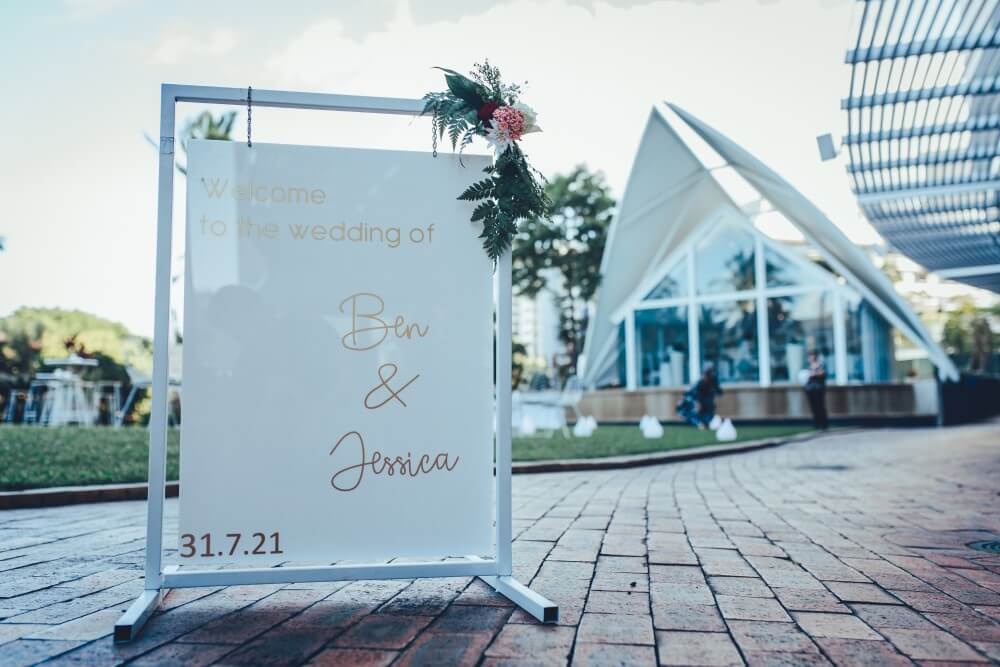 wedding sign with hilton blue horizon chapel in background