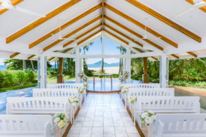indoor view of Alamanda Chapel facing the beach with the glass walls retracted