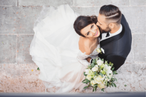 Bride and groom wearing a classic traditional wedding dress