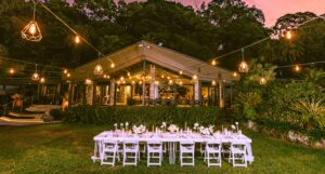 Trinity Beach Palace front view at dusk with a wedding reception setup on the front lawn