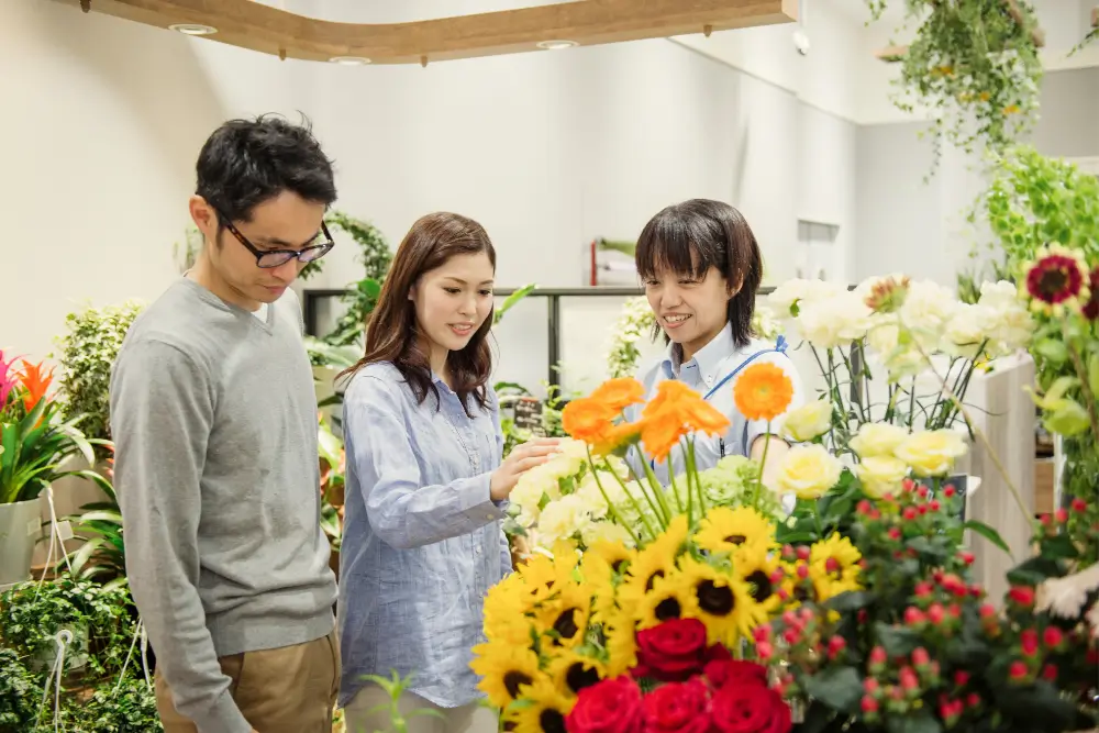 Couple deciding over bridal flowers for their seasonal wedding