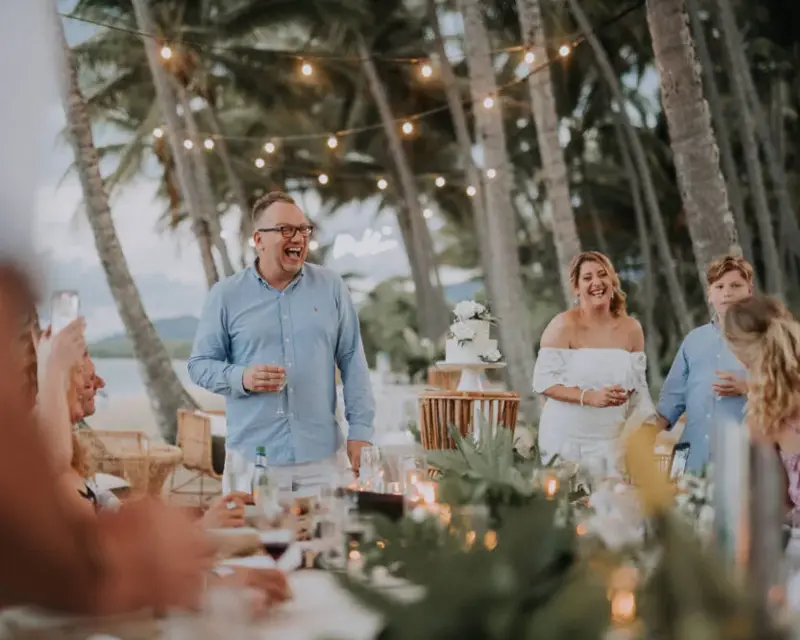 Guest sharing a wedding toast with other wedding attendees at Alamanda Chapel