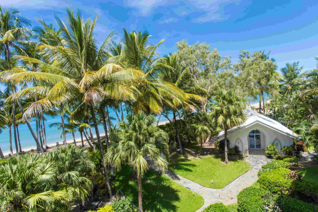 aerial view of Alamanda chapel in a beachfront location