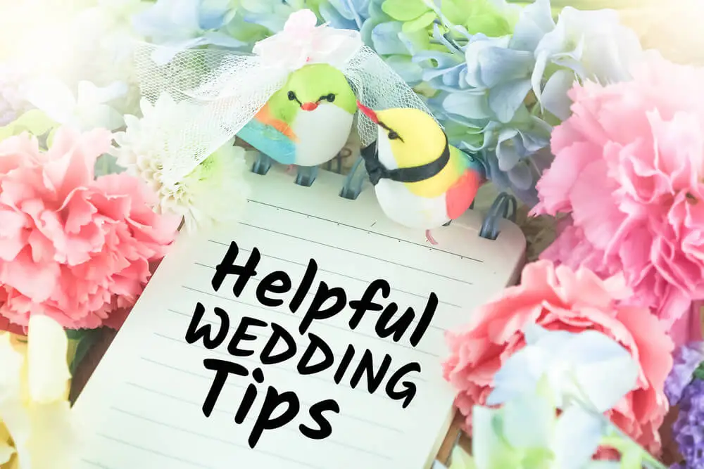“helpful wedding tips” on notepad with flower decor